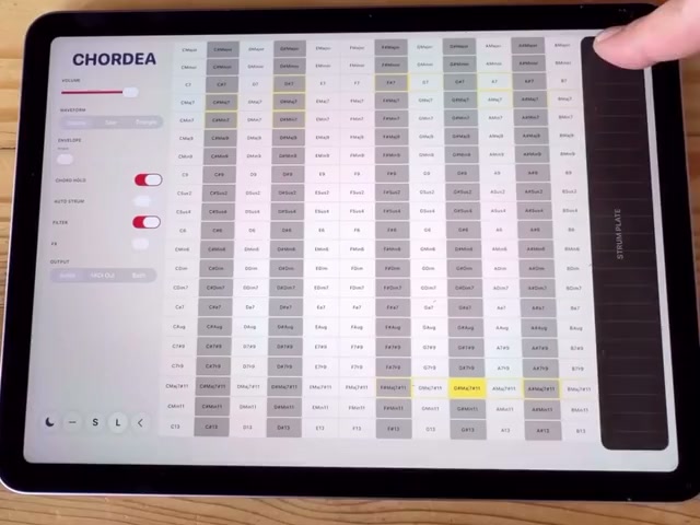 Hands playing CHORDEA on an iPad.